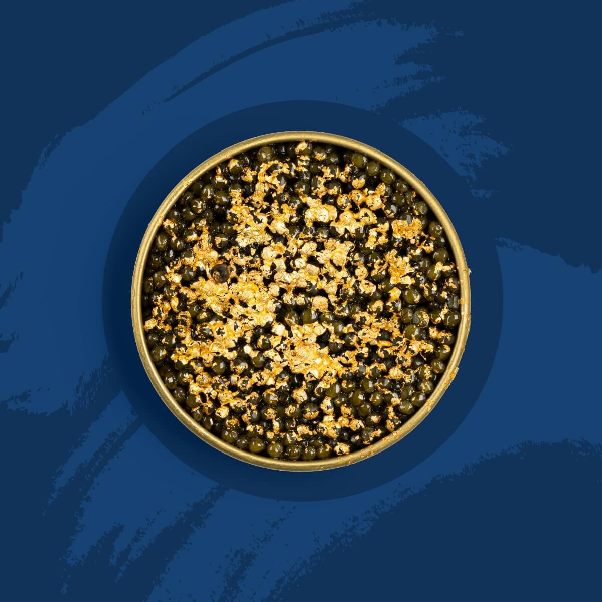 Black caviar pearls covered with gold flakes on a blue background.