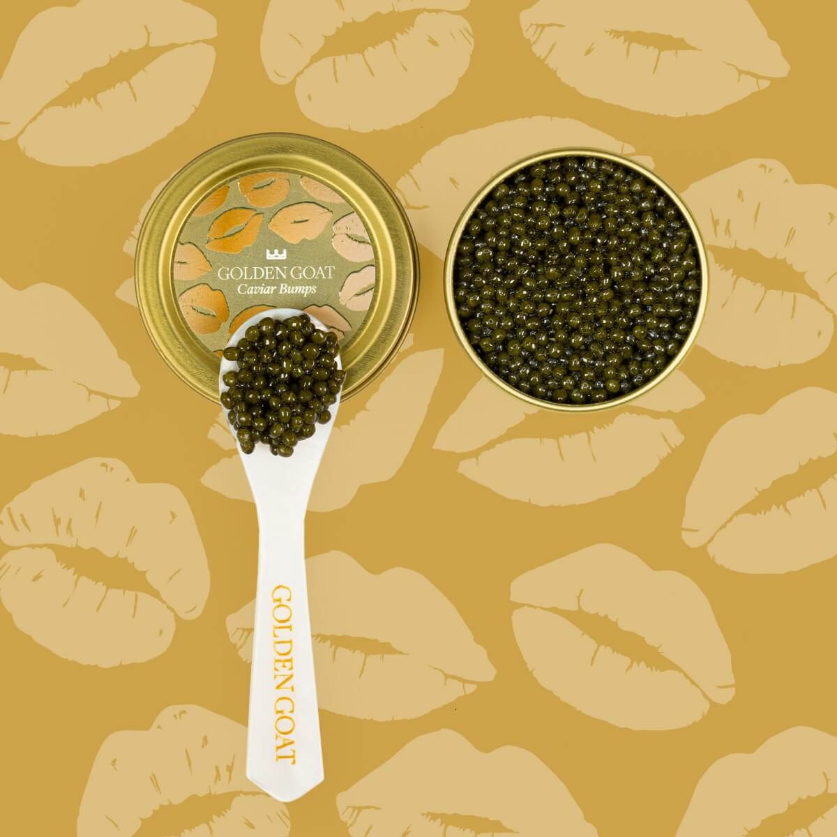 Caviar in a gold container with a spoon on a background of lips.