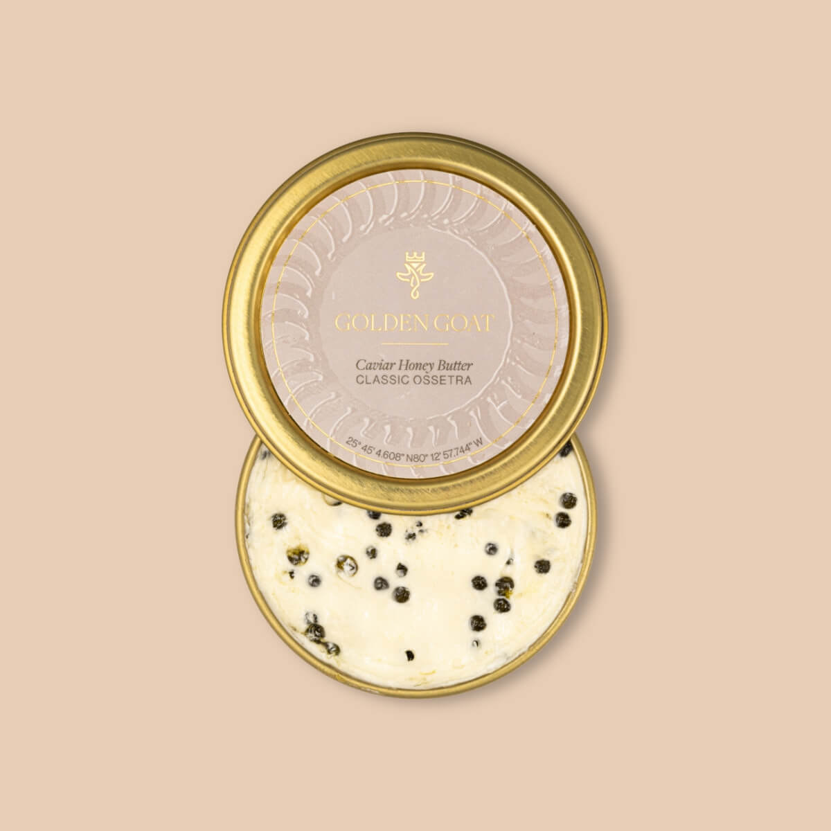 Gold container of caviar honey butter with lid on a beige background