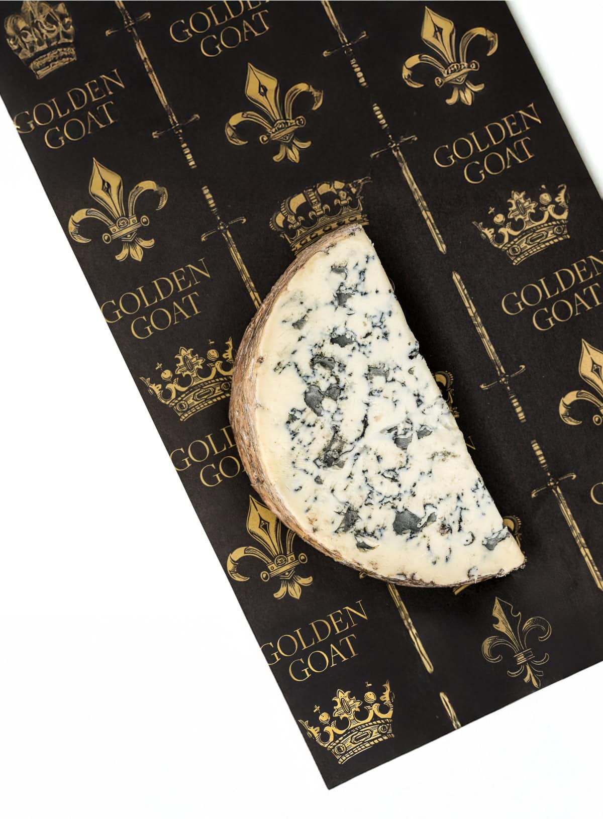 A wedge of blue cheese with a mottled rind, placed on a paper with 'GOLDEN GOAT' and crown motifs.