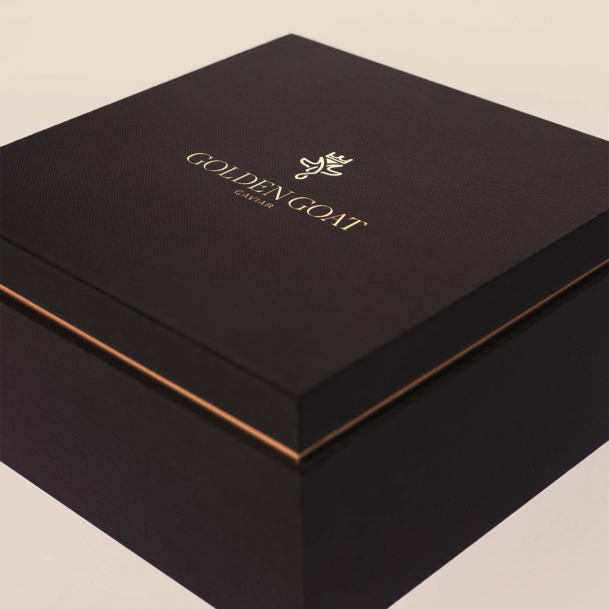 Closed gift box with the text GOLDEN GOAT and logo displayed prominently.