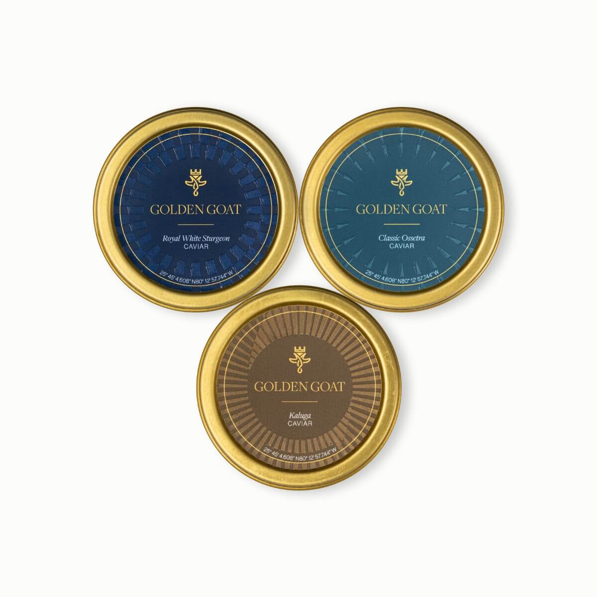 Three Golden Goat product tins on a white background