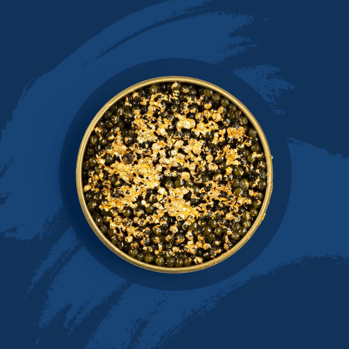 Black caviar pearls covered with gold flakes on a blue background.