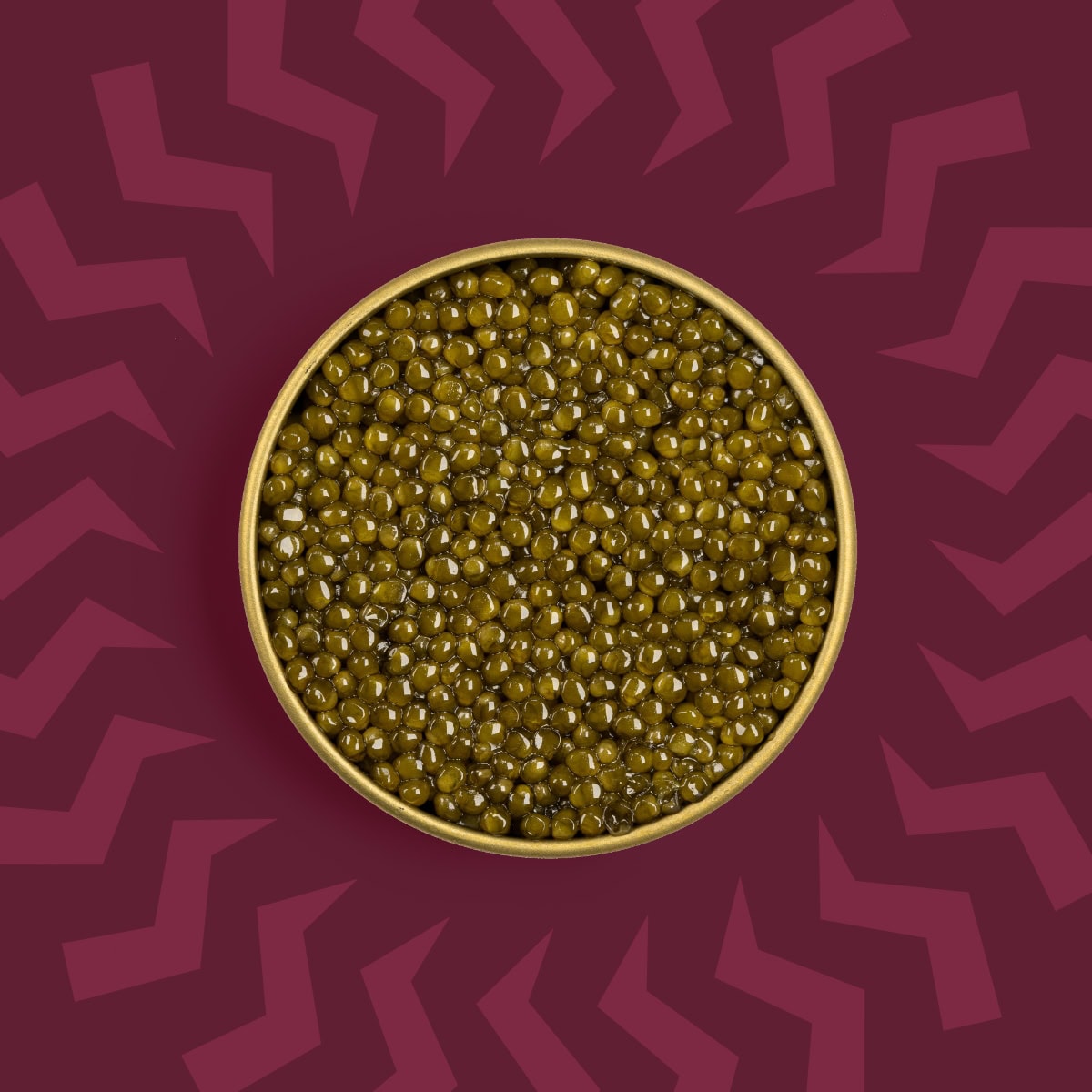 Golden caviar pearls in a tin on a red background with a lightning bolt pattern