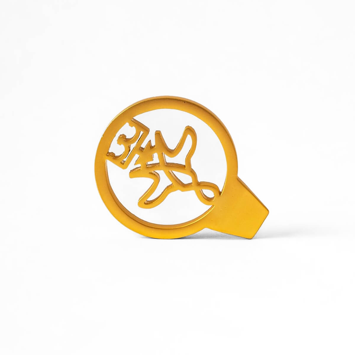 Gold metal caviar key with engraved goat design on a white background