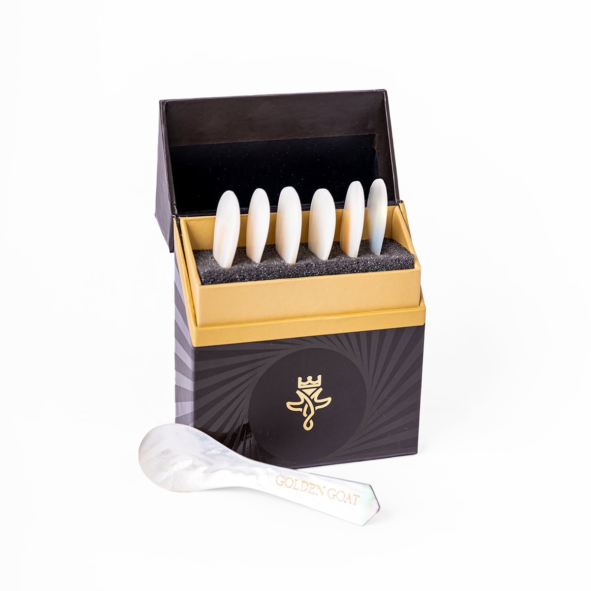 A box of Golden Goat branded caviar spoons in a box.