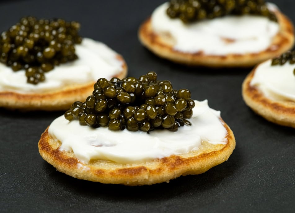 Why is crème fraîche the ideal spread with caviar?
