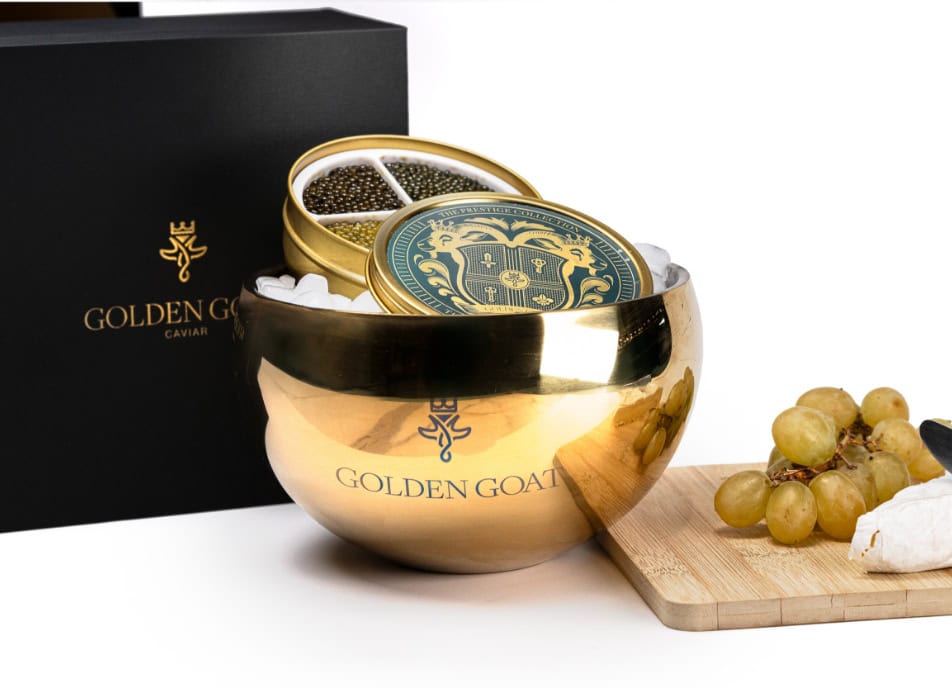 What size tins of premium caviar fit into the golden caviar server?