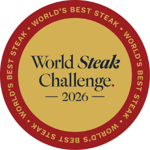 A circular award-style badge reading 'World Steak Challenge 2026' with a gold center and red border on a white background.