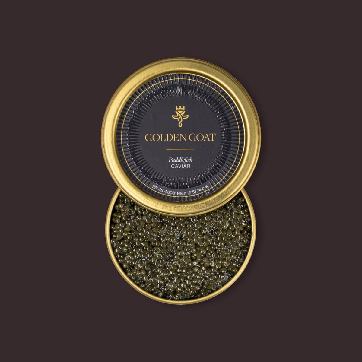 Gold container of Golden Goat caviar on a dark background